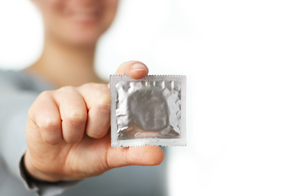 woman holding a condom